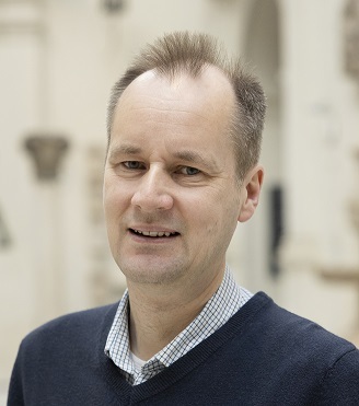 A man smiling at the V&A