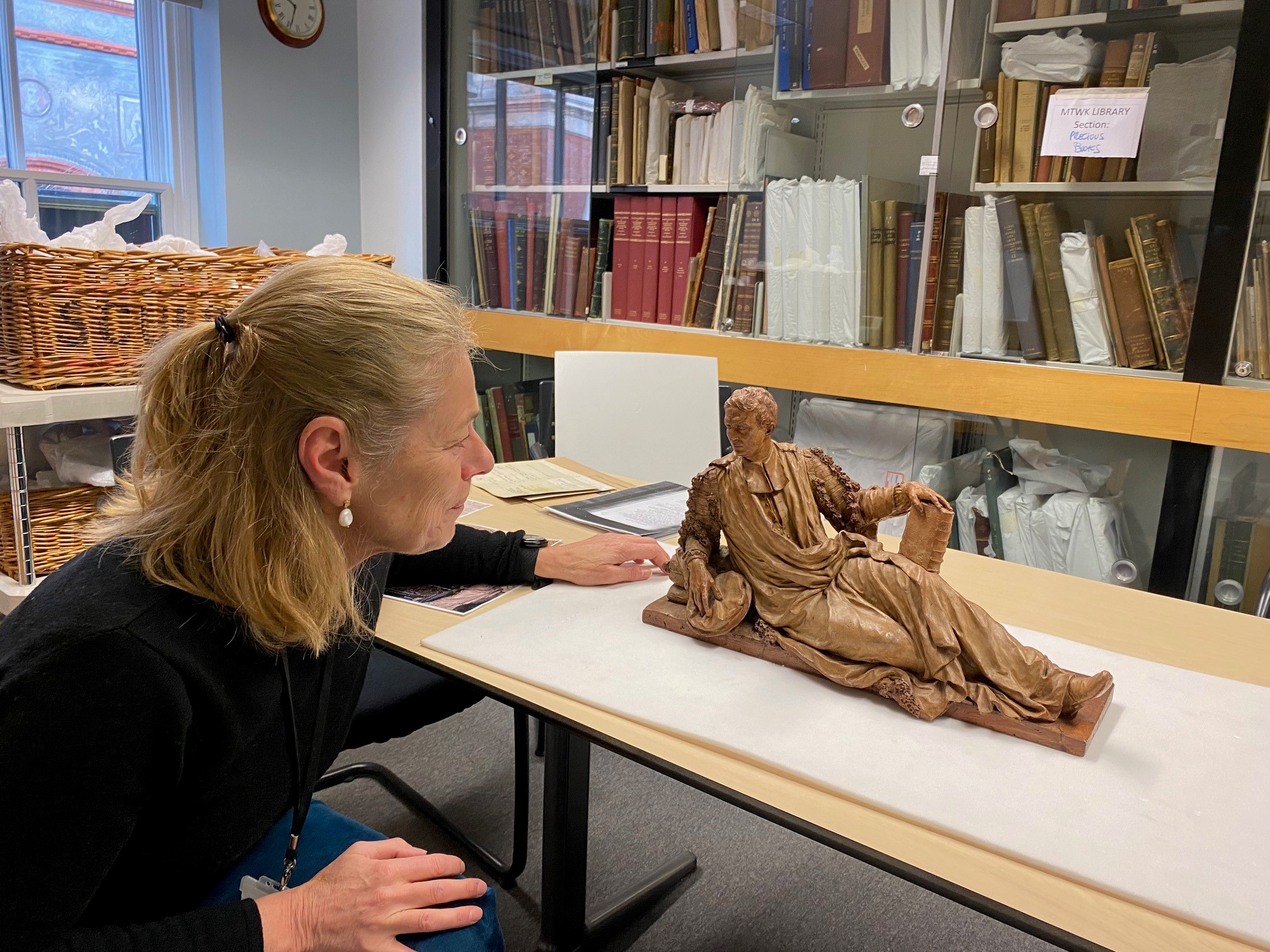 Susan Jenkins with small sculpture of a reclining figure